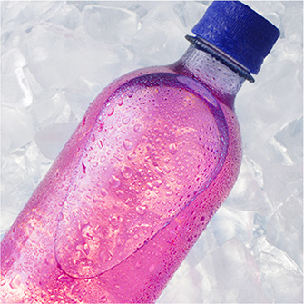 Flavored water bottle on ice